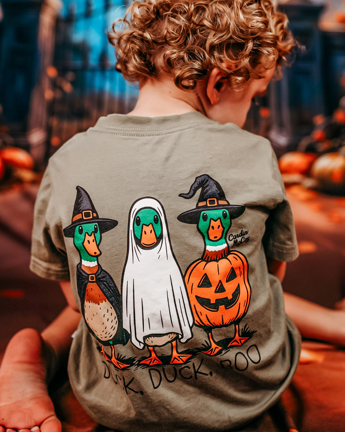 Duck Duck Boo tee with pumpkins in the background